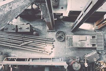 Aerial view of construction materials and equipment arranged on a worksite floor